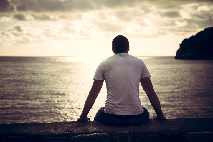 A man looking at the sunrise as he contemplates drug and alcohol detox