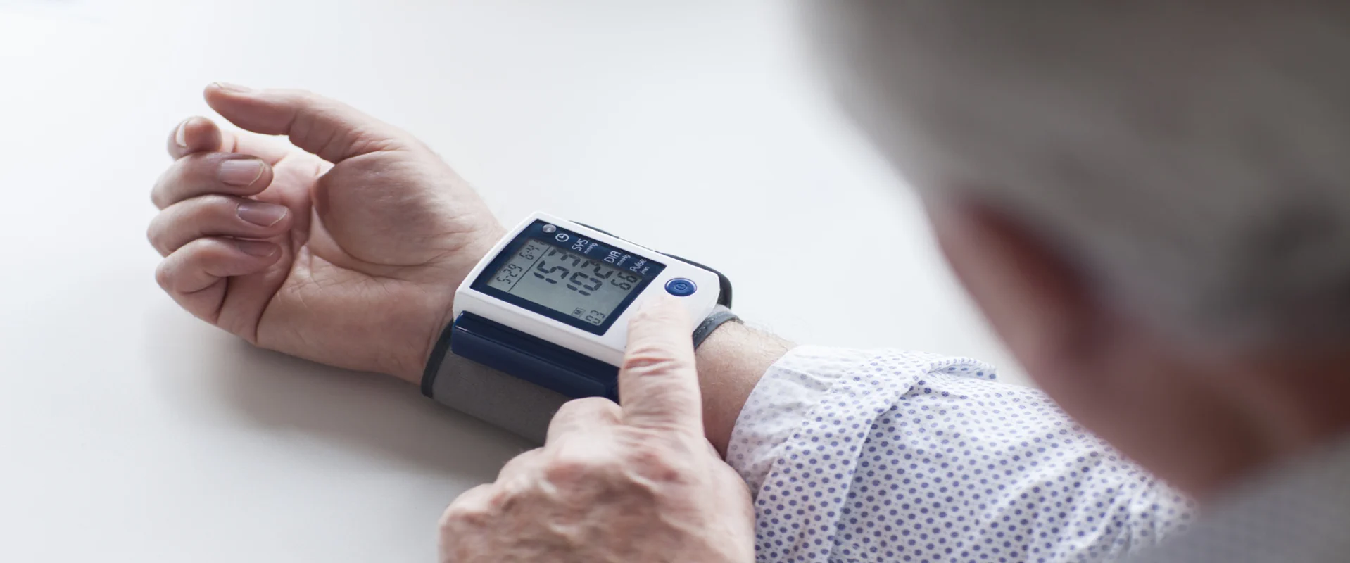 Man with high blood pressure while using a wrist device