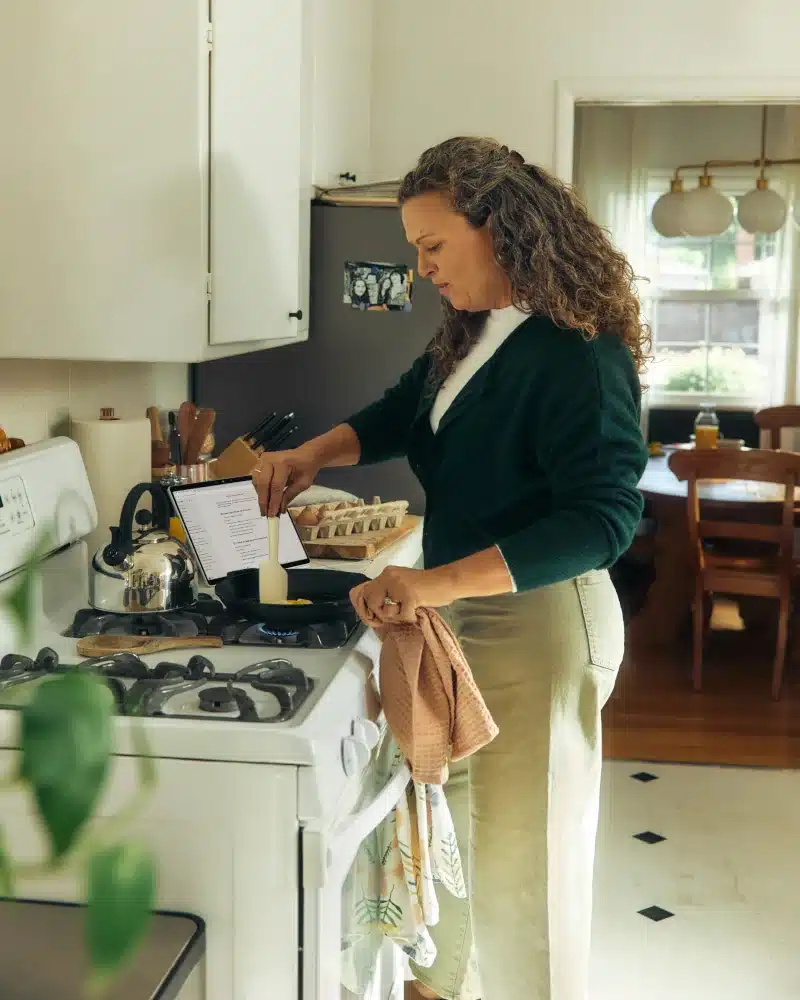 Woman cooking at home as part of a healthy lifestyle routine during anxiety disorder treatment at Solstice Health and Wellness Sarasota Woman cooking at home as part of a healthy lifestyle routine during anxiety disorder treatment at Solstice Health and Wellness Sarasota