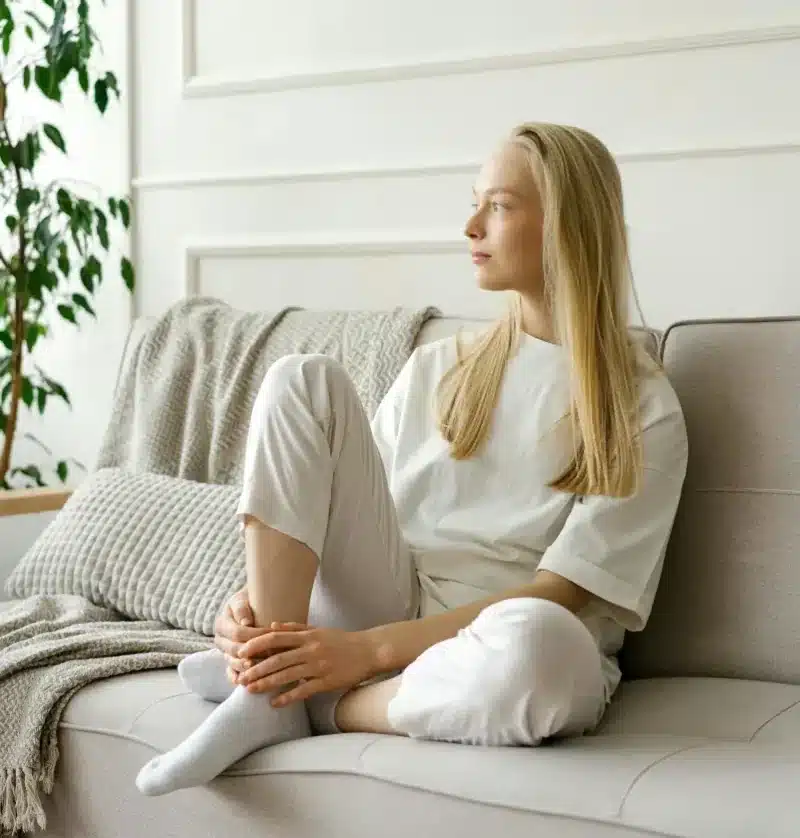 Woman looking out the window with a distant expression, mood changes associated with bipolar disorder Solstice Health & Wellness Sarasota FL Woman looking out the window with a distant expression, mood changes associated with bipolar disorder Solstice Health & Wellness Sarasota FL