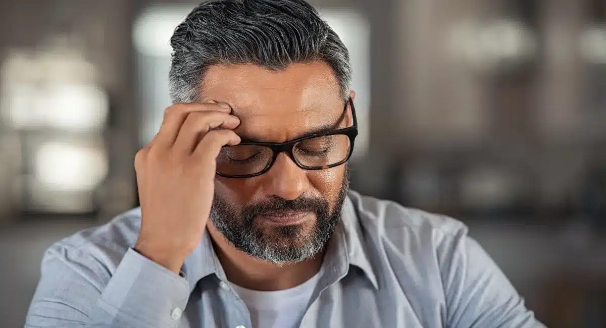 Person reflecting on symptoms of tobacco addiction and nicotine dependence Person reflecting on symptoms of tobacco addiction and nicotine dependence